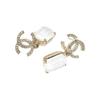 CHANEL Metal Brass Crystal Earrings Women's Gold/White