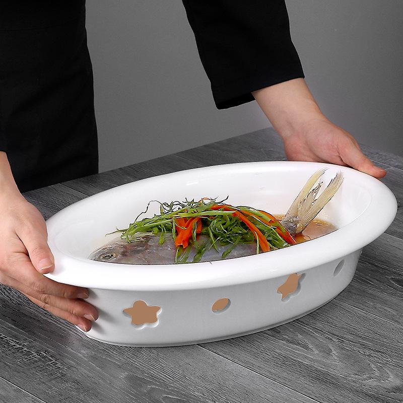 Ceramic Egg-Shaped Plum Blossom Grilled Fish and Warming Plate with White Round Heating Dry Pot Stove.