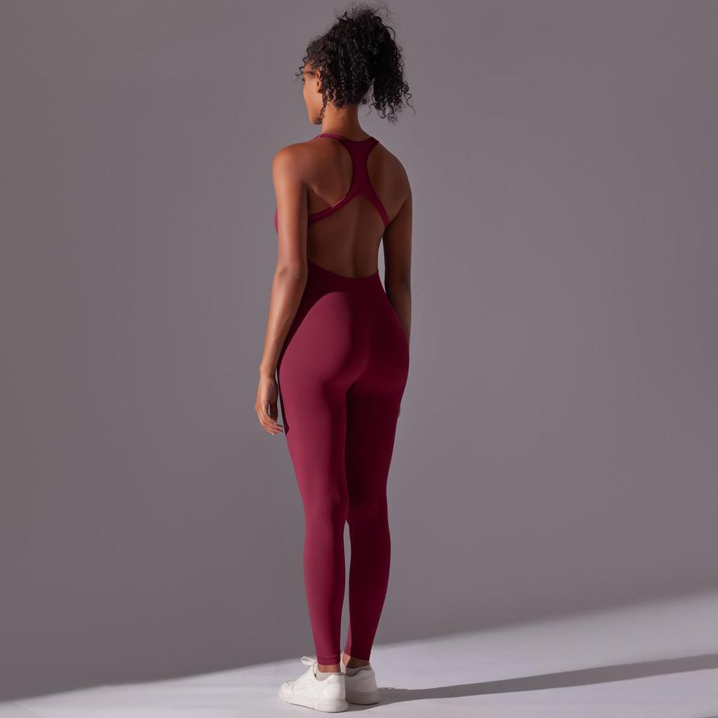 Sömlös enfärgad yogajumpsuit med öppen rygg