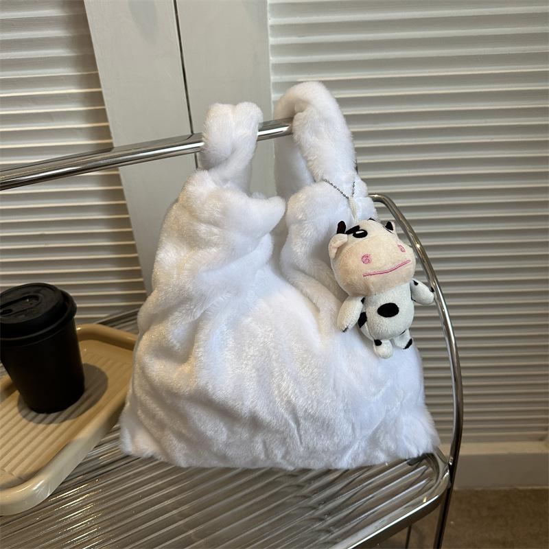 2025 Early Spring New Large Capacity Plush Trend Cow Pattern Personality Student Class Shoulder Bag Female Design Sense