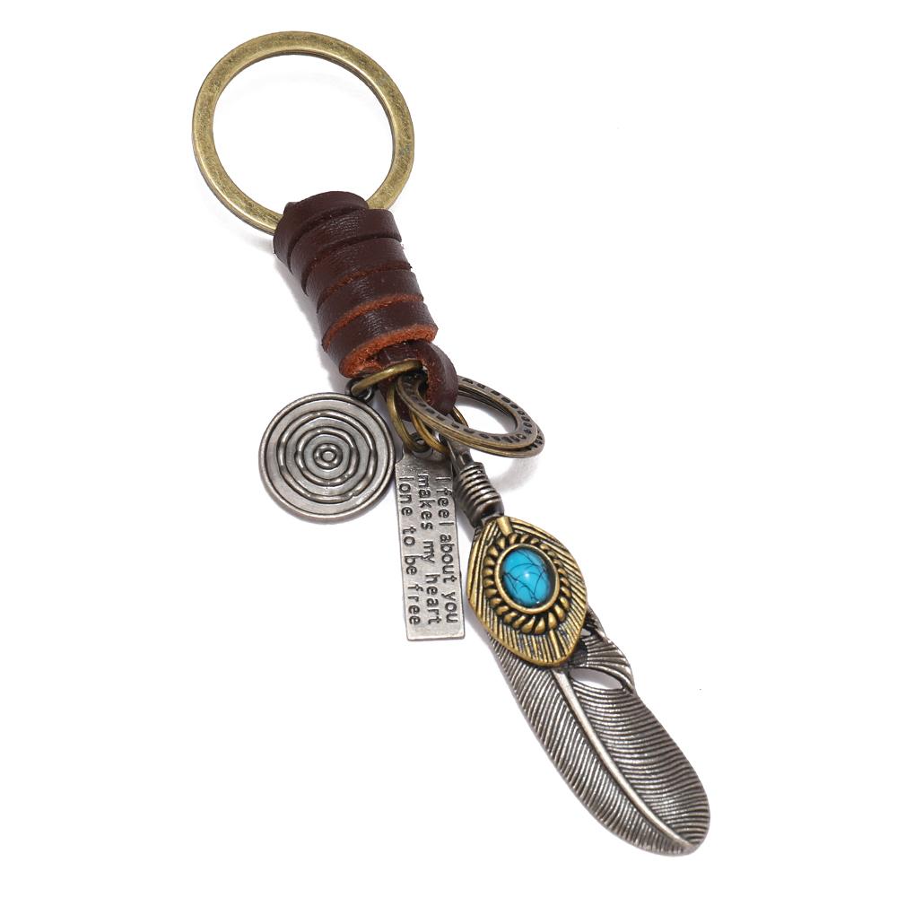 

Fashion feather pendant key rings men women key chains темно-коричневого кольору