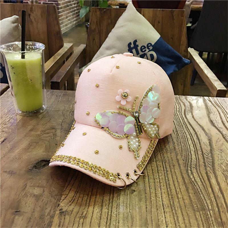 

Spring and summer Korean version butterfly studded diamond baseball cap outdoor women s sunshade metal three ring sun hat Adjustable розовый