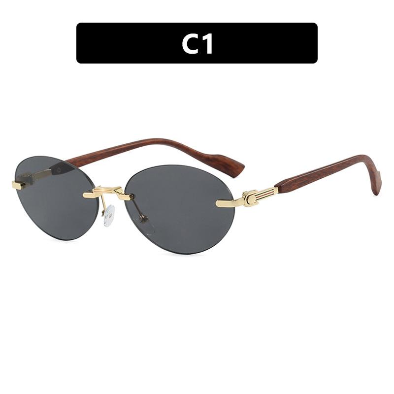 Frameless trimmed oval sunglasses catwalk fashion street shot sunglasses UV protection sunshade concave sunglasses as shown