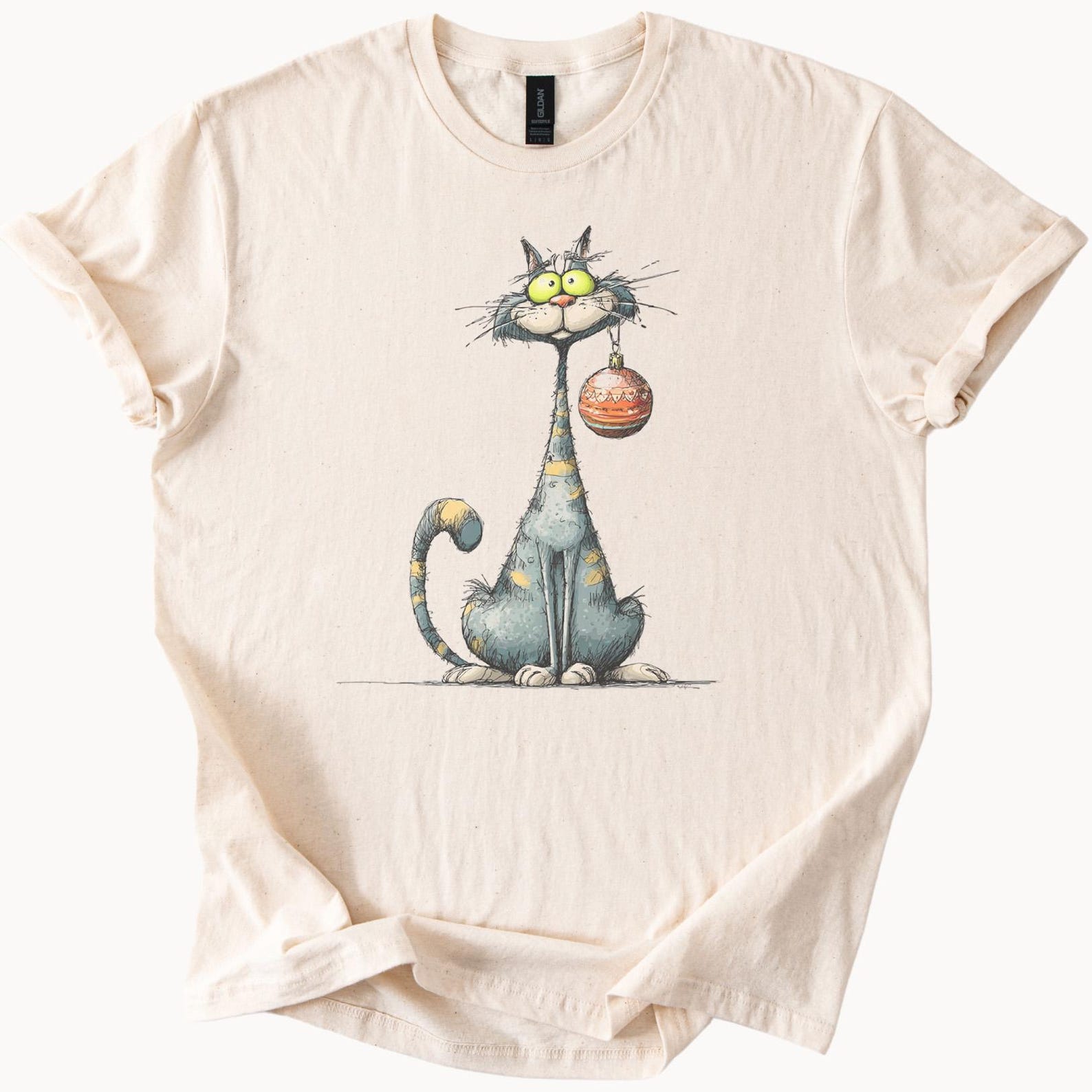 funny cat cartoon t shirt with quirky kitty holding ornament cool illustrated graphic tee for adults 150