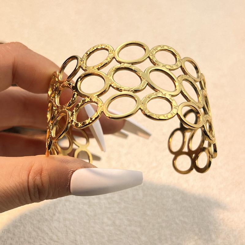 European and American Fashion Stainless Steel Hydraulic Bracelet Plated with 18K Gold Opening Design Sense Hollow Titanium Steel Bracelet