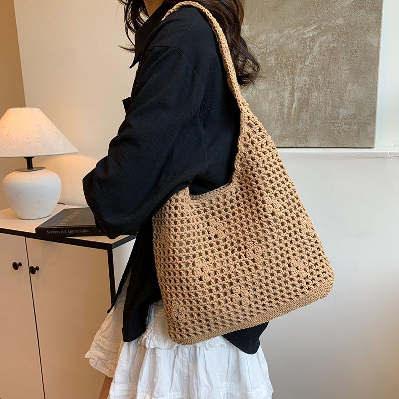 Niche hollow bucket bag women's summer new fashion woven beach bag leisure vacation shoulder bag