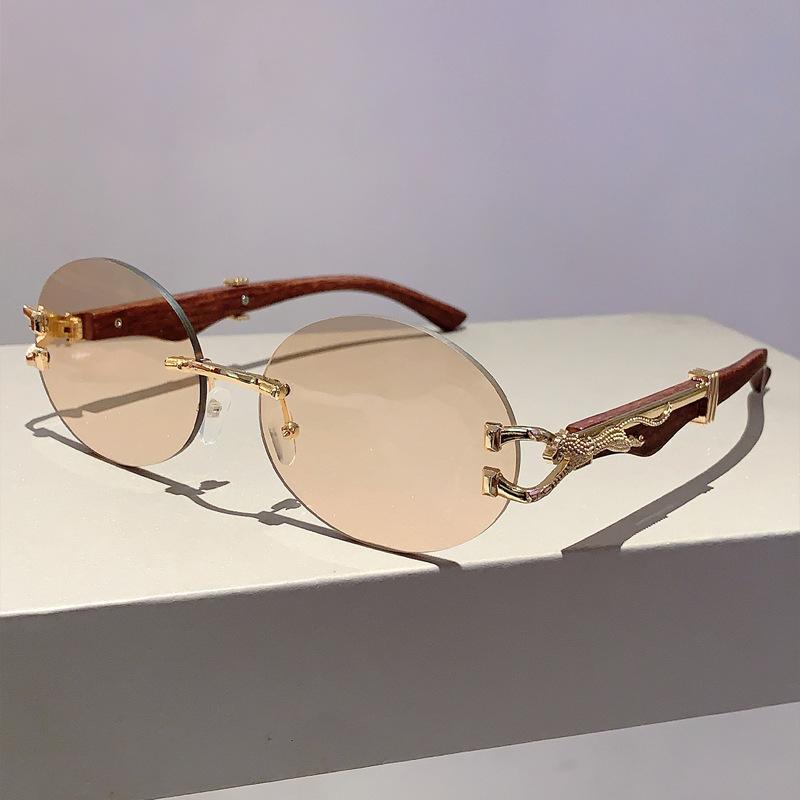 

Luxury Brand Designer Vintage Rimless Oval Sunglasses Women For Men Sun Glasses Trendy Punk Popular Metal Leopard Eyeglasses