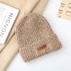 Autumn and winter pullover warm wool hat women's fashion leather label knitted confinement hat outdoor cycling sports hat