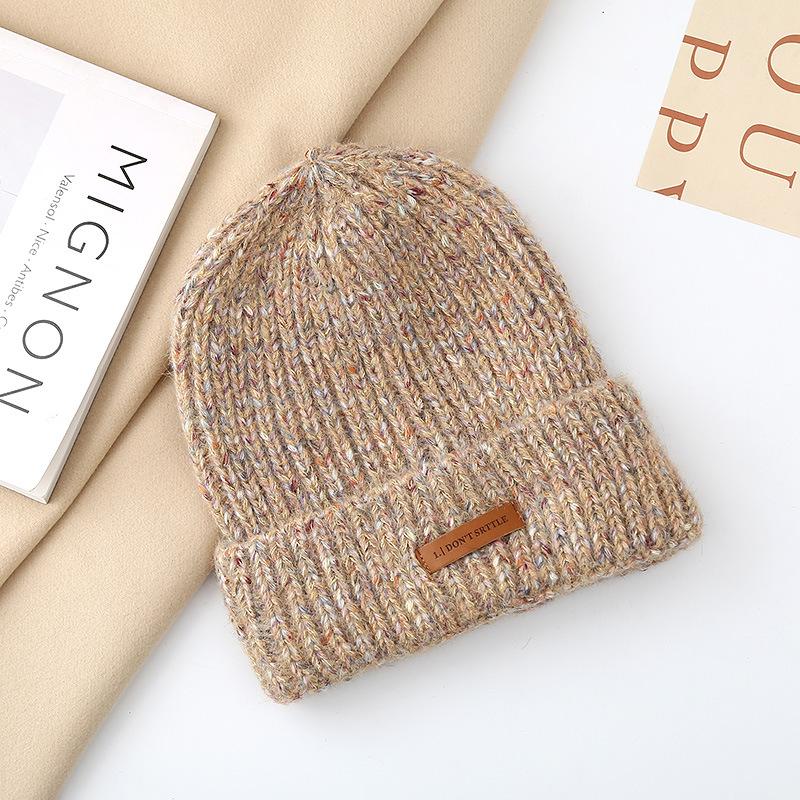 Autumn and winter pullover warm wool hat women's fashion leather label knitted confinement hat outdoor cycling sports hat