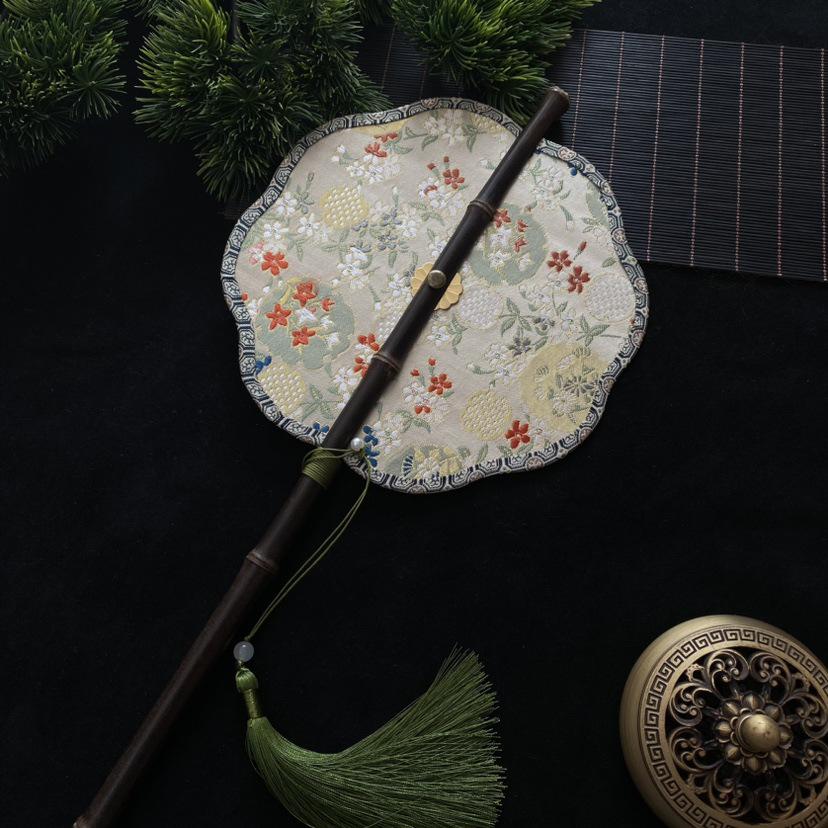 Hanfu Round Fan: Ancient-Style Purple Bamboo with Long Handle, Tassel, and Foldable Design.