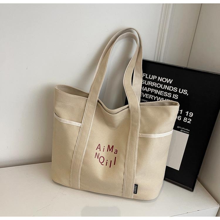 Lässige Canvas-Tragetasche Damen Herbst und Winter Schlichte Große Kapazität Ausgehen Leichte Tragetasche Pendlertasche