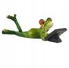 Frog Figurine Lying With a Tablet