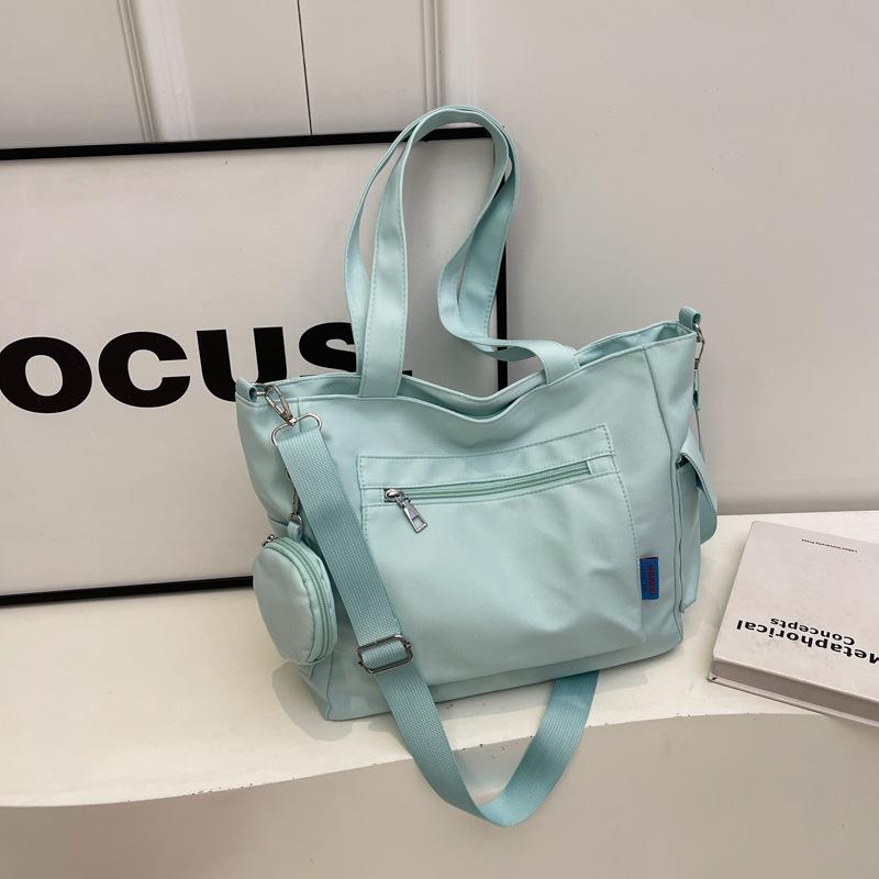 Japanese-Style Canvas Crossbody Bag: Double Pocket, Large Capacity, Women's Tote, Solid Color, Perfect for Students and Commuting.