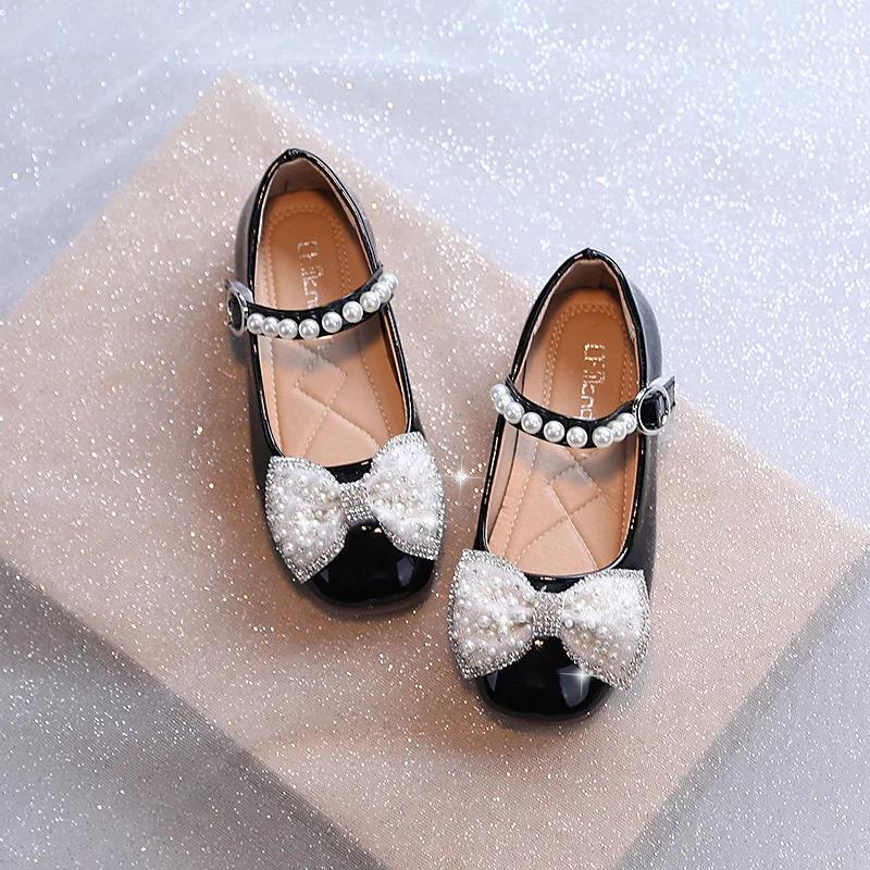 

Детская кожаная обувь с круглым носком, глянцевая, черная, для выступлений, со сладким бантом, 2024 новая, детская обувь на плоской подошве, мягкая подошва, нескользящая 21 чёрный