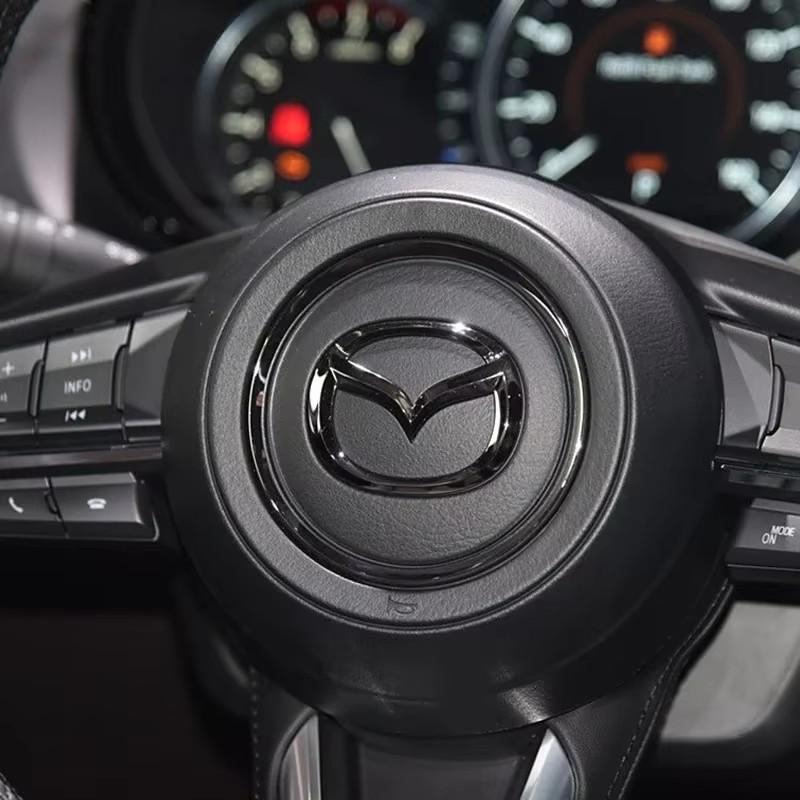 AAGI1 Car Steering Wheel Emblem Sticker Decoration Accessories For Mazda 2 3 6 5 Atenza CX3 CX5 MX5 CX7 Axela CX30 CX90 CX60 CX50 MX30