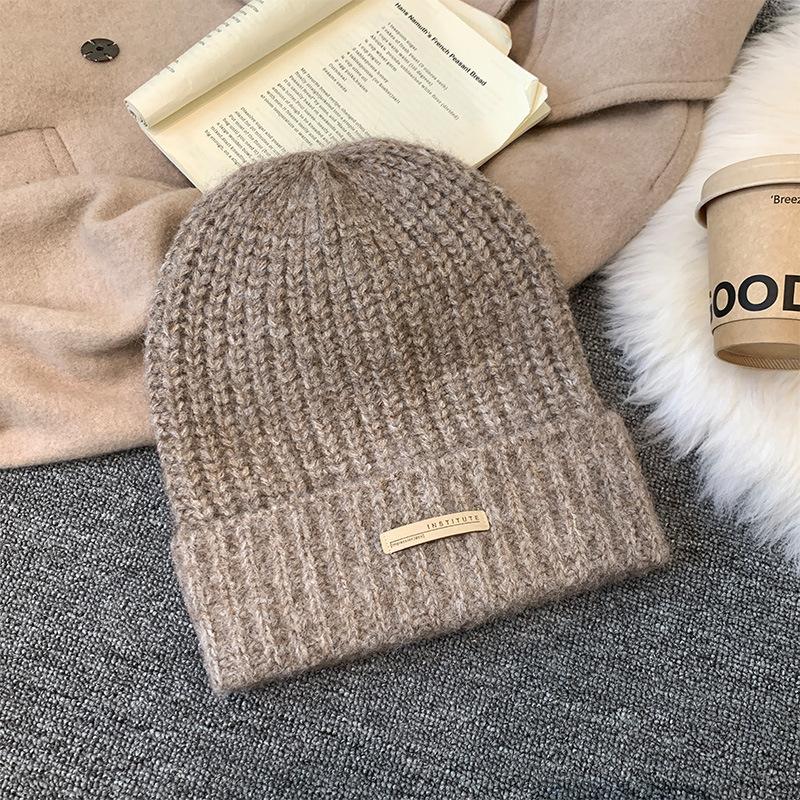 Gray knitted wool hat women's winter versatile warm pile hat showing face small cold hat ear protector bag head hat