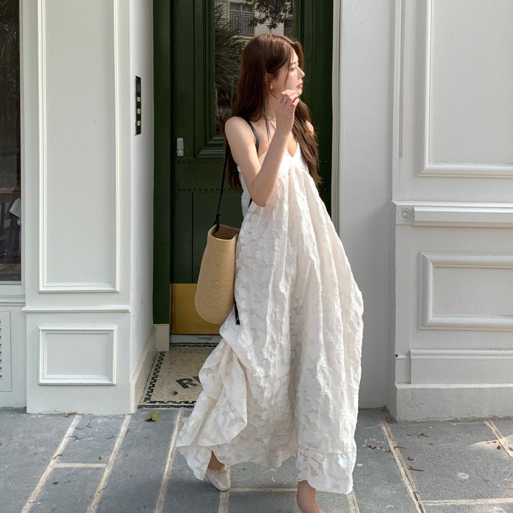 French temperament neck dress women's early spring new seaside vacation wind backless A-word long dress fairy dress