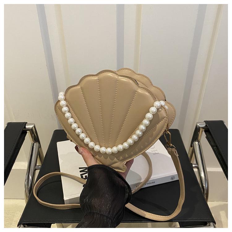 

Трендовая осенняя женская сумка кроссбоди в корейском стиле с тиснением в виде ракушки