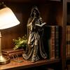 Tabletop Resin Sculpture with Hooded Character, Open Spell Book, and Bronze Style Finish for Shelf Display Use