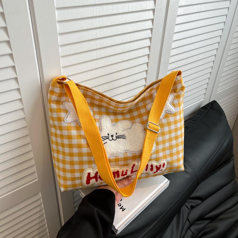

Spring and summer plaid canvas bag female 2025 new cartoon student class messenger bag large capacity shoulder tote bag жёлтый