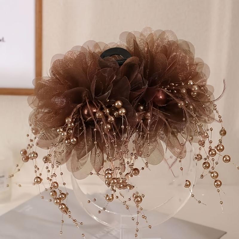 

New round bead tassel mesh flower acrylic hair claw. Luxurious oversized rhinestone flower, non-slip shark clip. Stylish for daily & festive wear.