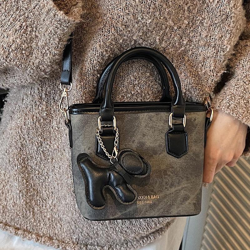 Textur trendige Nischentasche Herbst neu retro Schulter Umhängetasche Mode tragbare Eimertasche Damen