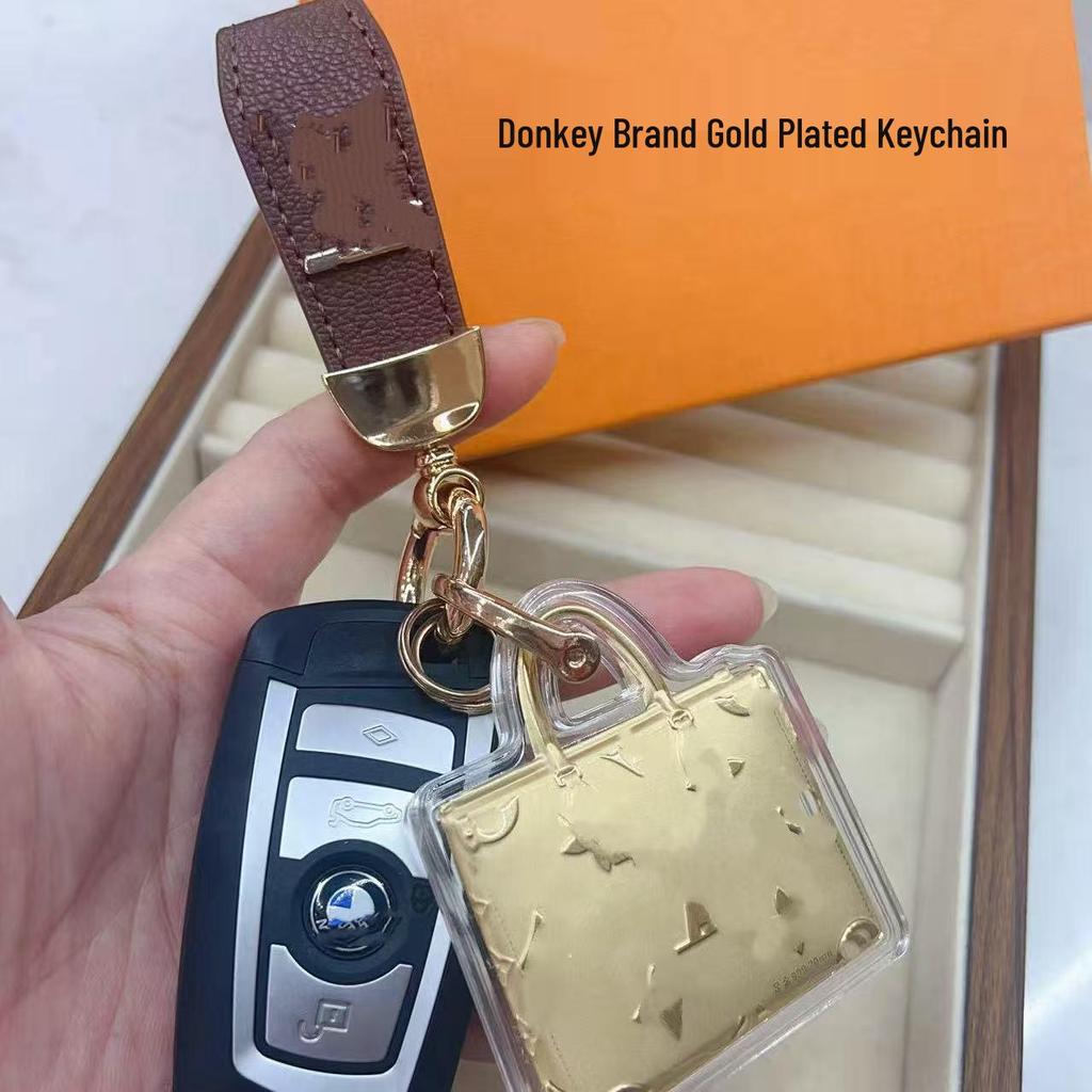 V-Shaped Gold Donkey Keychain with Leather Pendant and Pure Gold Ornament