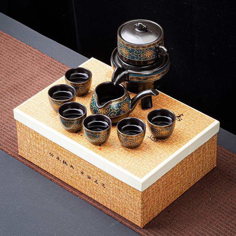 New Chinese lazy stone grinding semi-automatic tea set stone grinding ceramic retro gilt printing tea set small gift