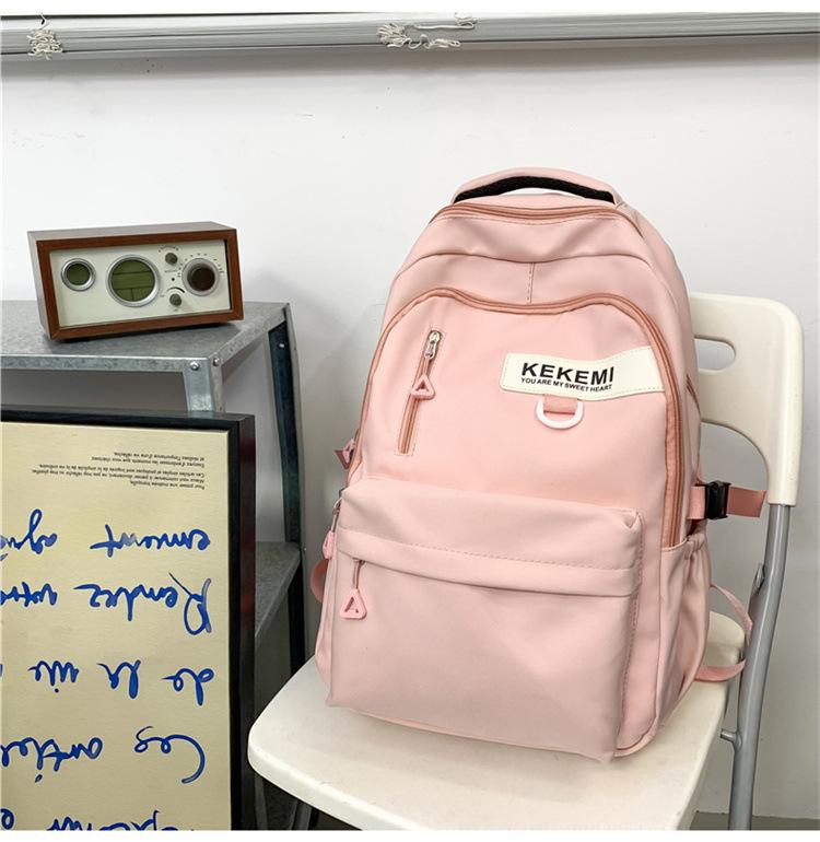 Schoolbag backpack men's 1011 new versatile large-capacity college backpack girls simple junior high school high school bag
