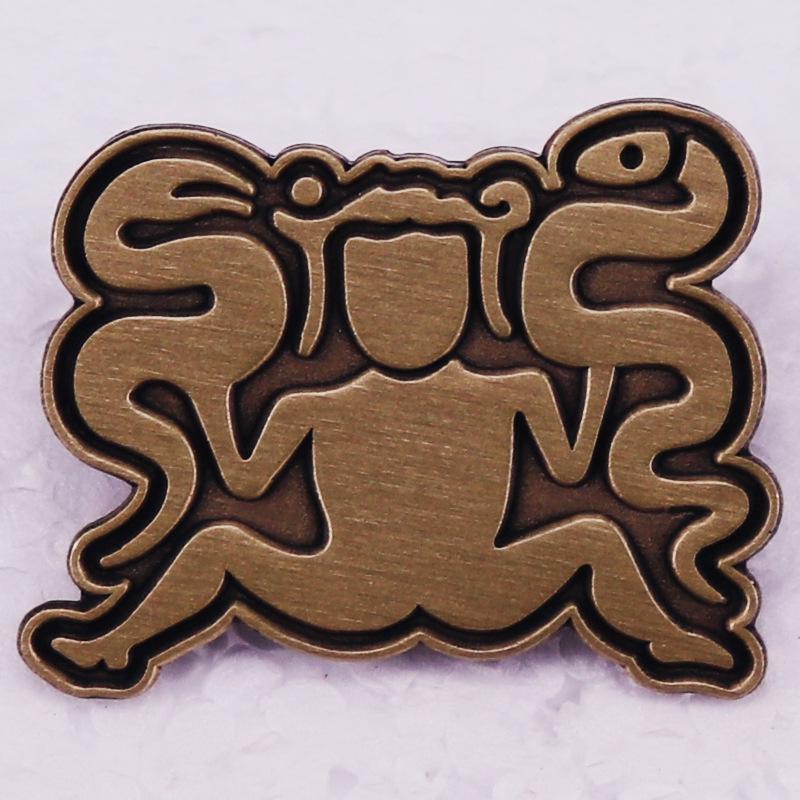 

Archaeological Commemorative Snake Charmer Vintage Brooch