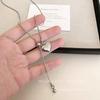 Elegant Silver Heart Pendant Necklace for Women - High-End Titanium Steel with Drawstring Long Sweater Chain, Perfect for Autumn and Winter.