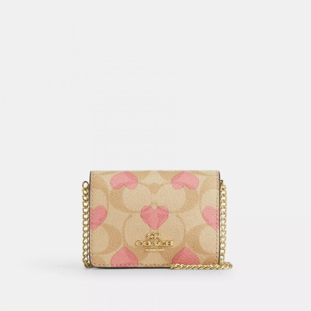 

Мини-кошелек Coach в штучной упаковке на цепочке из фирменной парусины с принтом в виде сердечек