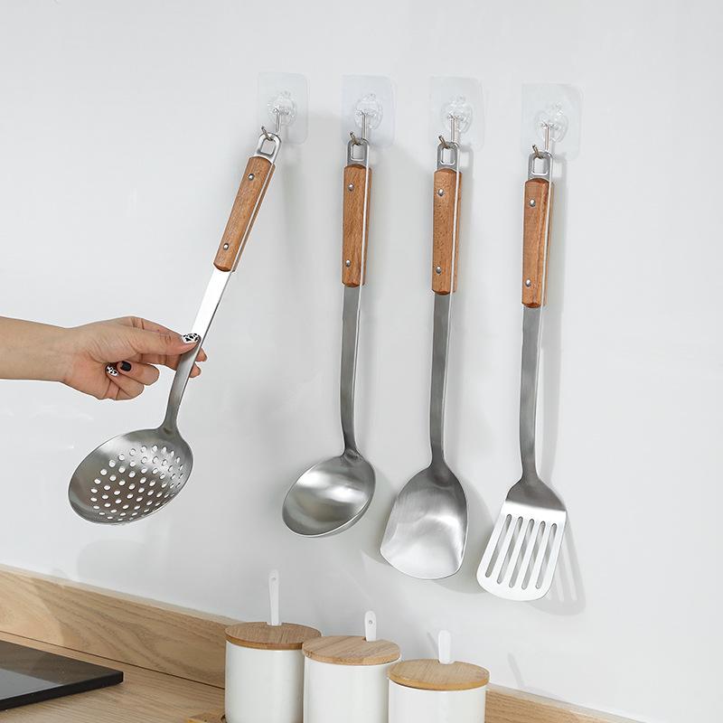 Stainless Steel Kitchen Utensil Set: Spatula, Frying Shovel, Soup Ladle & Slotted Spoon with Anti-Scald Wooden Handles.