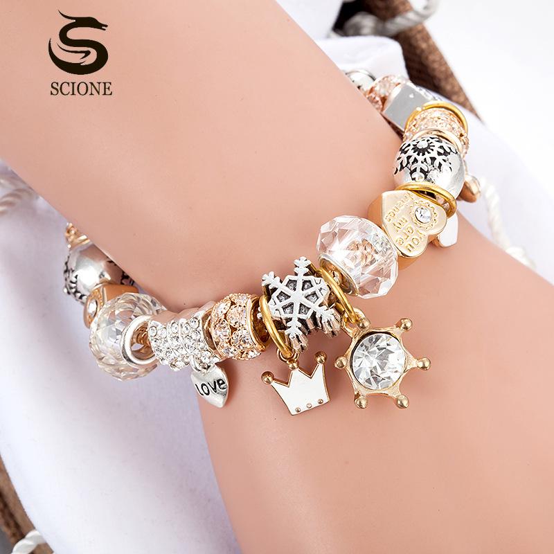 SCIONE Náramek s krystalovými korálky, korunou a láskou, sněhovou vločkou a přívěskem