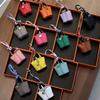 Mini vegetable basket bag pendant high-end leather car keychain earphone bag creative car pendant wholesale