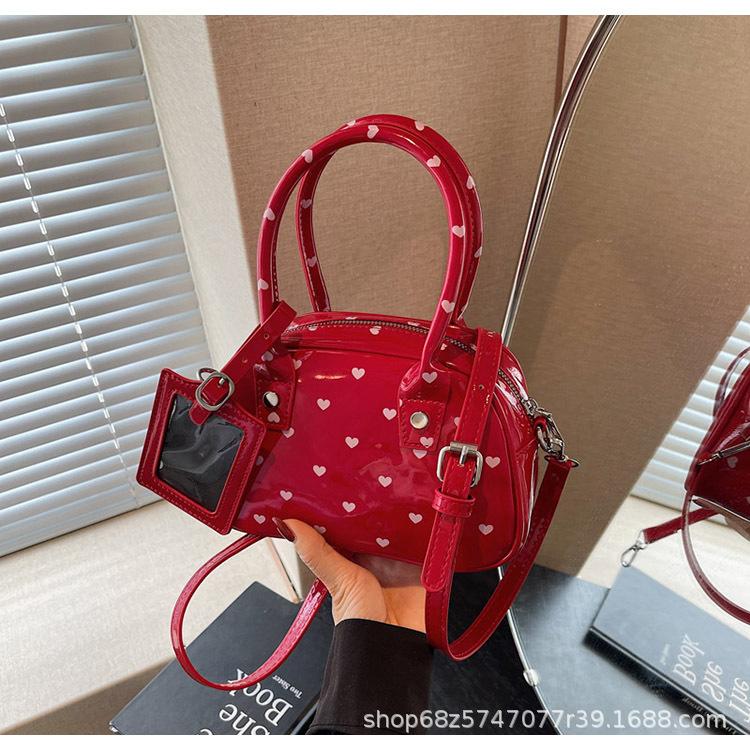 

2025 new commuter hand-held shell bag versatile fashion polka dot messenger bag niche design portable bowling bag бордовий