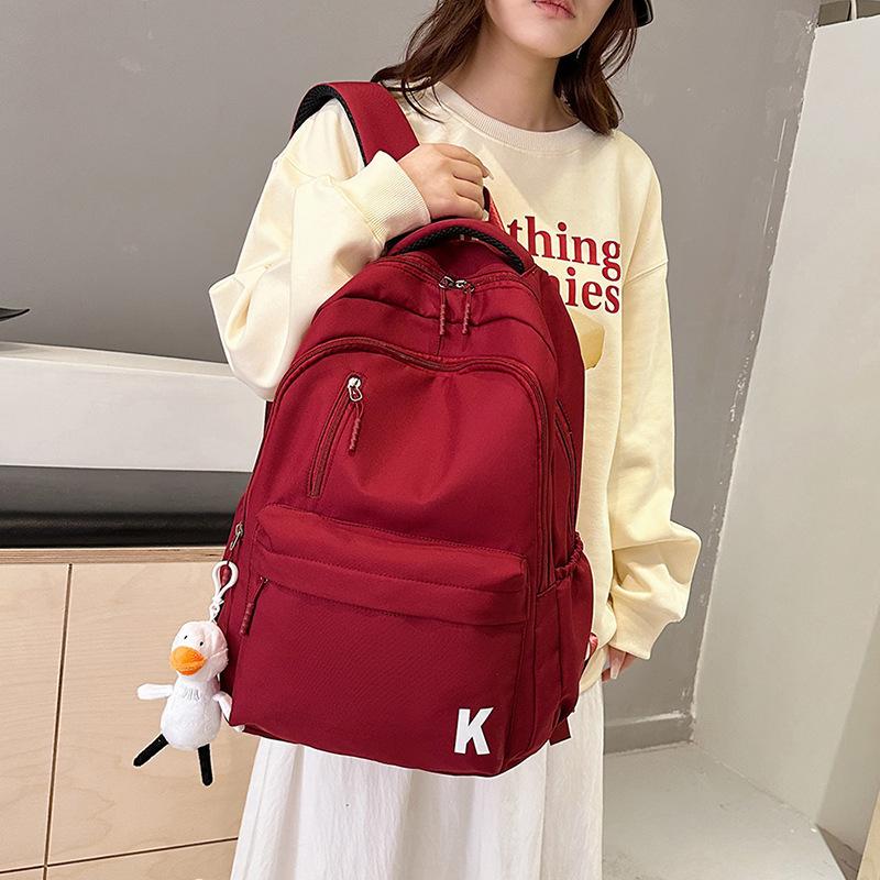 Schoolbag new backpack, junior high school student backpack, large-capacity schoolbag, load-reducing spine protection, large-capacity backpack.