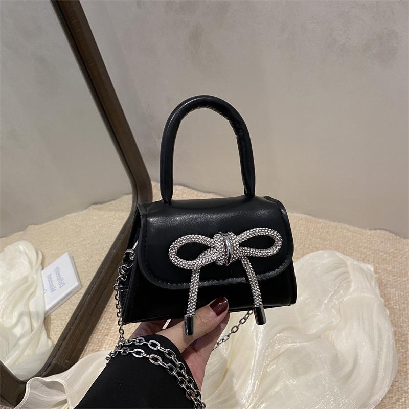 2026 Fashi Women's Mini PU Leather Handbag with Metal Chain Strap&Oversized Bow Top Handle Crossbody Bag for Decorative Purse