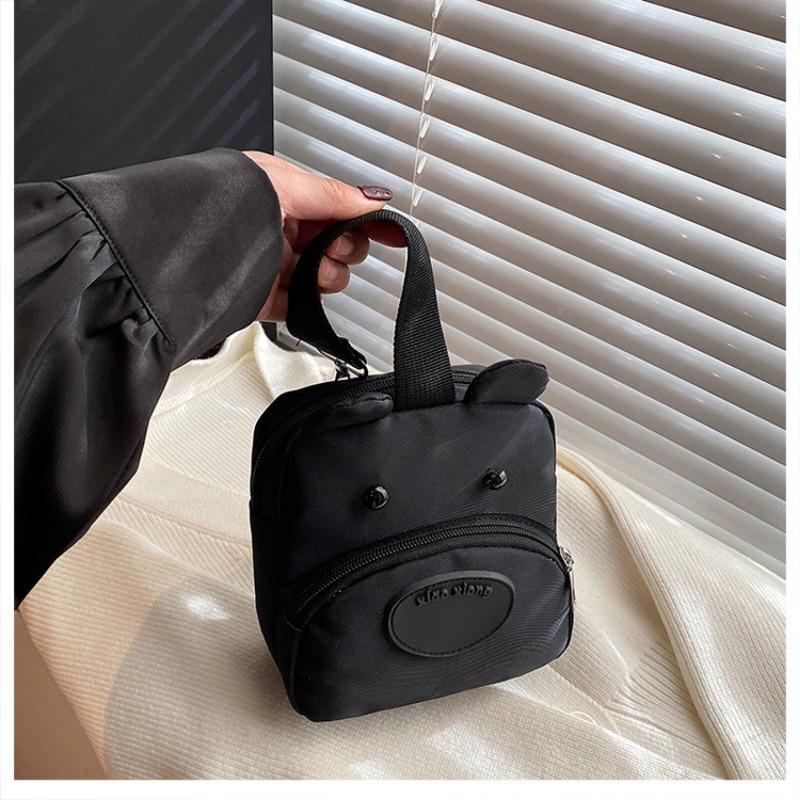 

New cute cartoon hand bag female dog change parent-child bag girl student travel simple mobile phone bag чёрный
