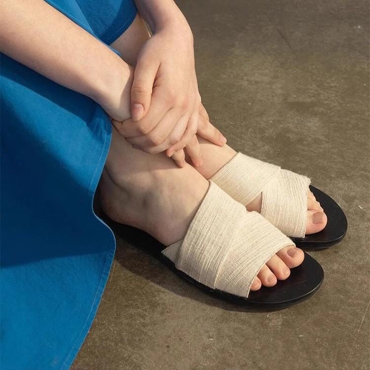 Niche canvas one-word broadband cool slippers women's 2025 summer new open-toed lazy drag simple casual flat-bottom drag