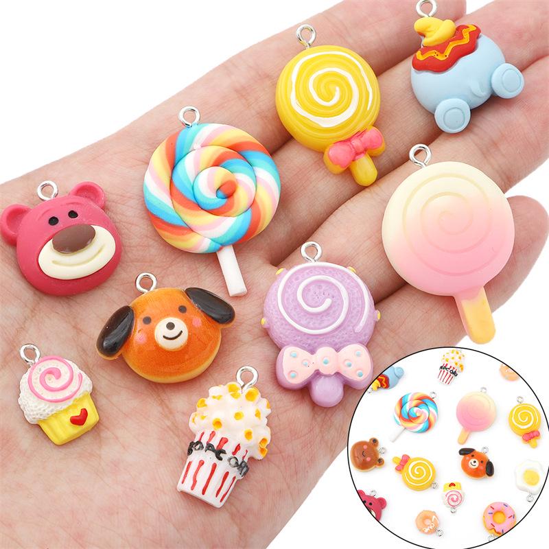 DIY pryskyřičné šperky a doplňky: Přívěsky Žlutá kachnička, Včelka, Růžový medvídek, Kobliha, Dinosaurus, Vejce, Lízátko.