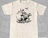 Retro Jesus reitet auf Dinosaurier 90er Jahre T-Shirt | Vintage Jesus Shirt | He Is Rizzen Shirt | Lustiges Unisex Entspanntes Grafisches T-Shirt für Erwachsene | Christliches Geschenk
