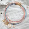 Böhmisch-inspirierte mehrschichtige geflochtene Seilkette mit Anhängern in Form von Sonne, Muschel und Schnecke, Strand-Choker für den Urlaub am Meer