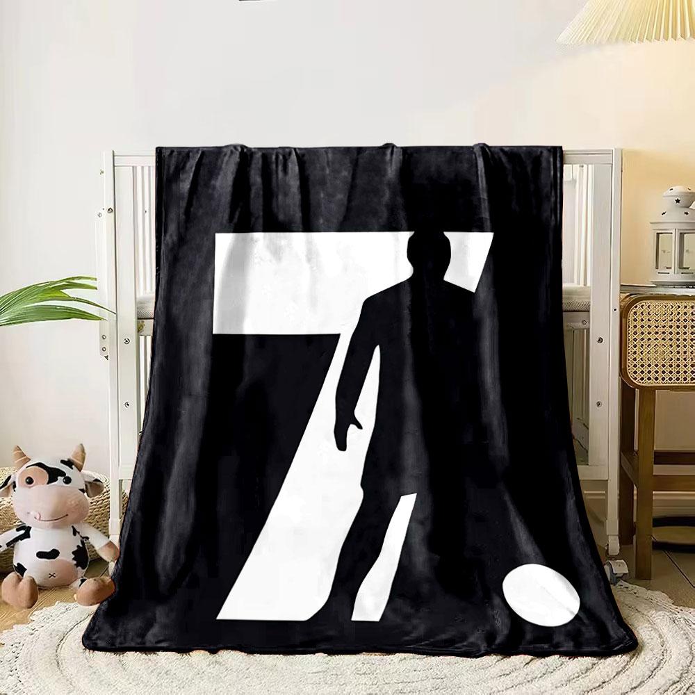 Silhouette of a figure within the number 7 alongside a circle on black background. for all seasons blanket lunch break throw gift 80cm x 120cm