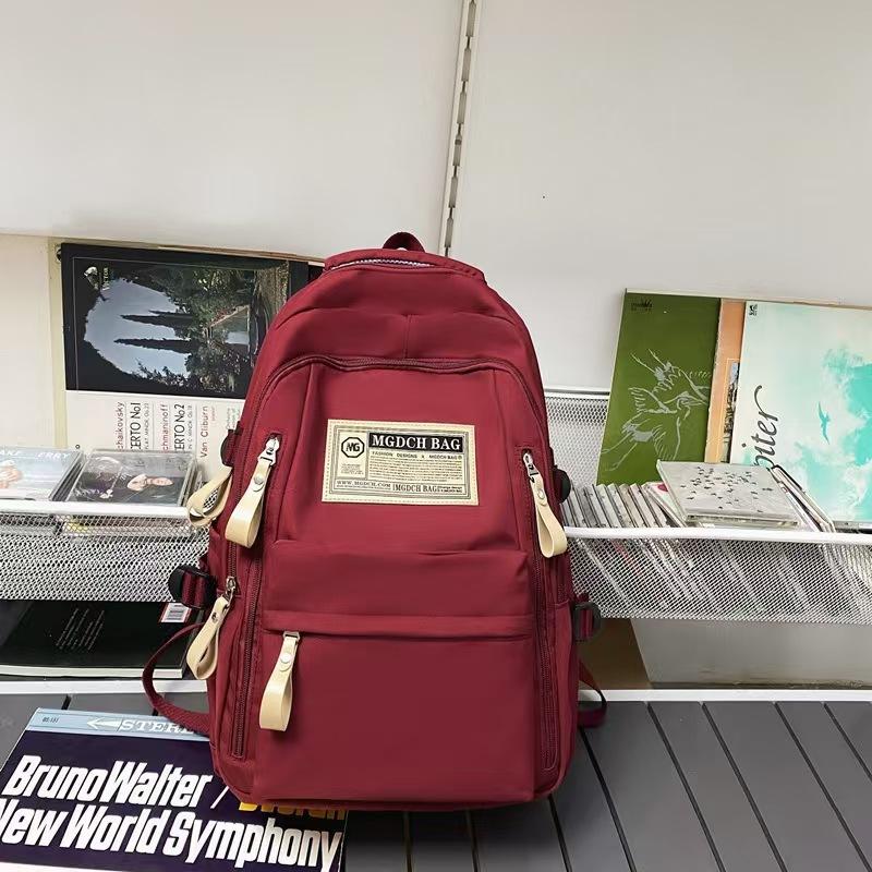 

Spring and summer simple travel backpack computer backpack solid color ultra-light junior high school student schoolbag campus wind красный