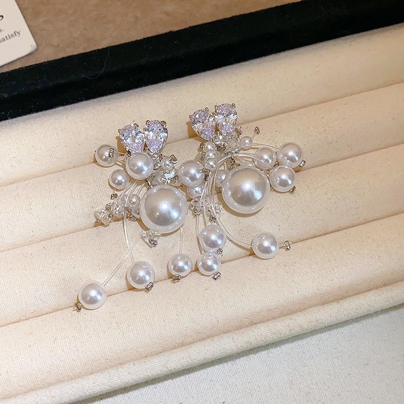 Silver Needle Cross-Border Tassel Earrings: Women's Versatile, Stylish Studs with a Unique, Trendy Design.