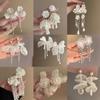 Pendientes de botón con forma de flor y lazo súper de hada plateados Pendientes de moda de lujo ligero francés Pendientes dulces versátiles de estilo literario