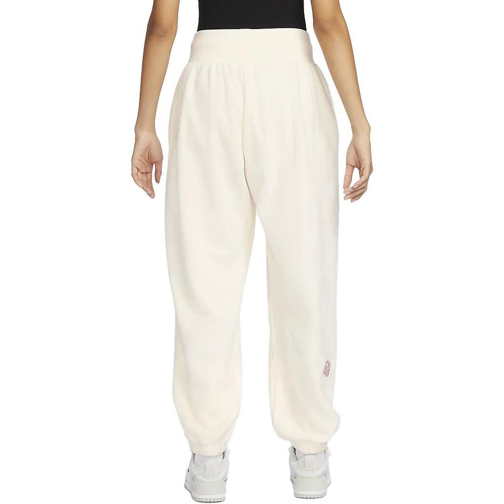 Nike Pantaloni da tuta casual affusolati a maglia a vita alta con coulisse e logo ricamato da donna Avorio chiaro FD5502-110