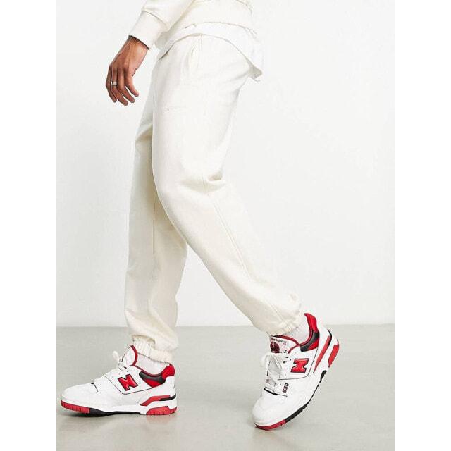 

Белые спортивные штаны New Balance Athletics State