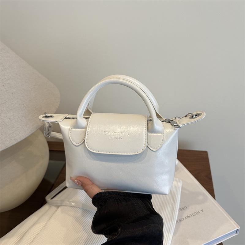 

Niche contrasting color small bag women s new fashion portable dumpling bag spring and summer texture single shoulder crossbody белый